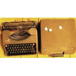 An Empire Aristocrat portable typewriter