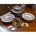 A pair of silver plated wine coasters with turned wood bases, an antique wine funnel with parcel