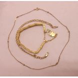 A 9ct. gold necklace - sold with a yellow metal similar and a gold plated bracelet