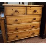 A 32" modern waxed pine chest of two short and three long graduated drawers, set on bun feet