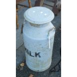 A vintage painted metal milk churn