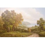 J. Chilton: a gilt framed oil on canvas depicting an extensive landscape of woodland and path