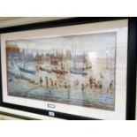 †L. S. Lowry: a framed coloured print, entitled "The Beach" - 15 1/2" x 30"