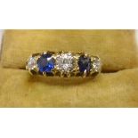 An 18ct. gold ring, set with three diamonds interspersed with two sapphires