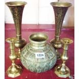 A pair of brass candlesticks - sold with a pair of Middle Eastern niello work brass onion shaped