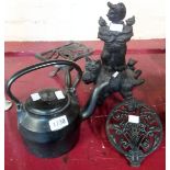 A cast iron kettle and stand - sold with a hearth stand, dog doorstop, etc.