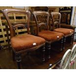 Three matching Victorian mahogany framed dining chairs with scroll rails, upholstered seats and