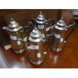 A pair of silver plated coffee pots and pair of hot water jugs to match