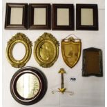 A box containing a quantity of small photograph frames including a pair of ornate cast brass frames,