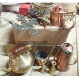 A box containing a collection of copper and brass items including jug, skillet, measure, etc.