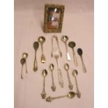 A small collection of silver mustard and salt spoons, a Norwegian marked .830 pickle fork and