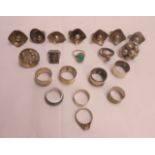 A collection of silver and white metal rings