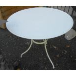 A 3' diameter modern metal table on metal legs