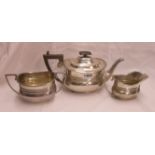 A silver three piece tea set of banded oval design - Sheffield 1906