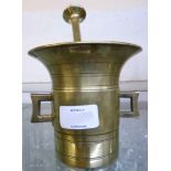 A 19th Century brass pestle and mortar with square handles