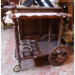 A 20th Century stained mixed wood wagon style drinks trolley with barley twist supports