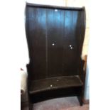 A 3' 3" antique high wingback tavern settle with later grained finish