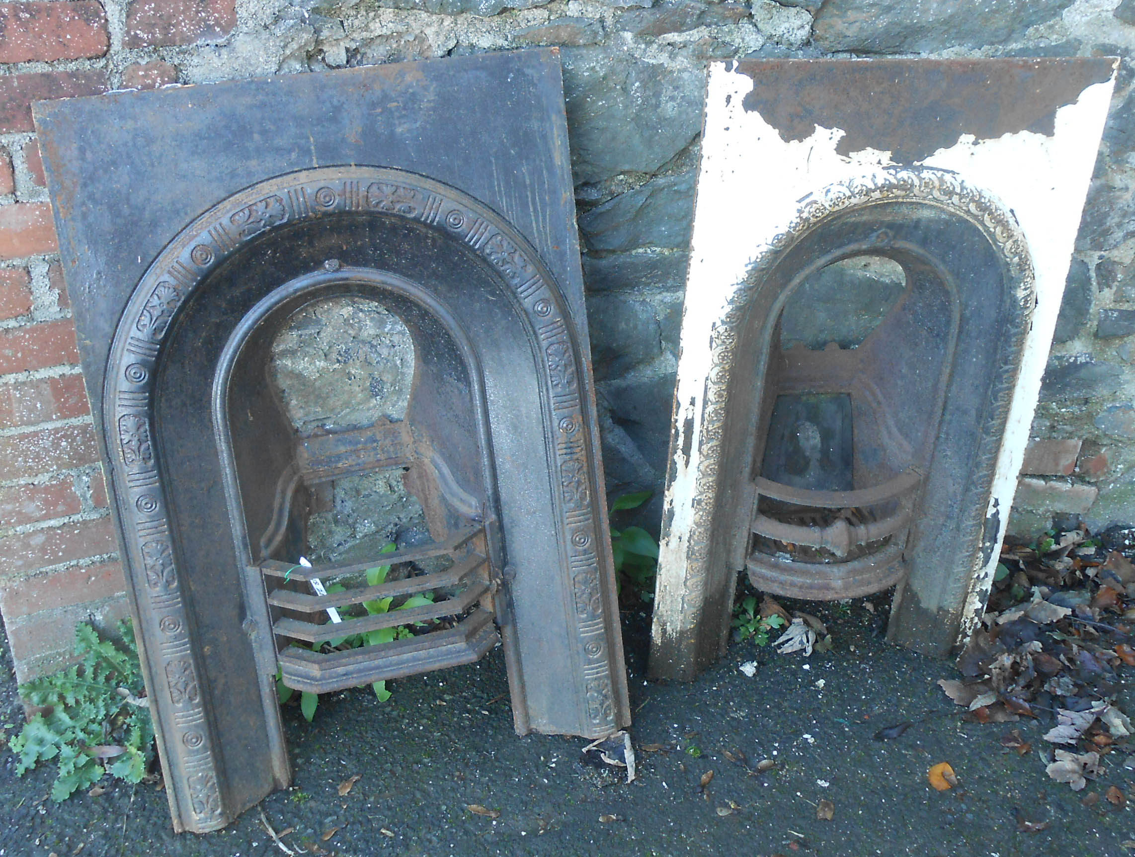 Two Victorian cast iron arched top bedroom fireplace inserts