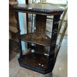 A 26" Victorian carved oak three tier corner unit with canted sides and moulded base