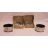 Two boxed small silver fronted photograph frames - sold with a pair of silver salts with blue