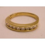 An 18ct. gold diamond set half eternity ring