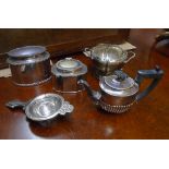 Two silver plated tea caddies, an Art Nouveau tea strainer, a sugar bowl and a small teapot