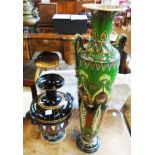 A 22 1/2" early 20th Century slender two handled vase with elaborate all-over decoration (a/f) -