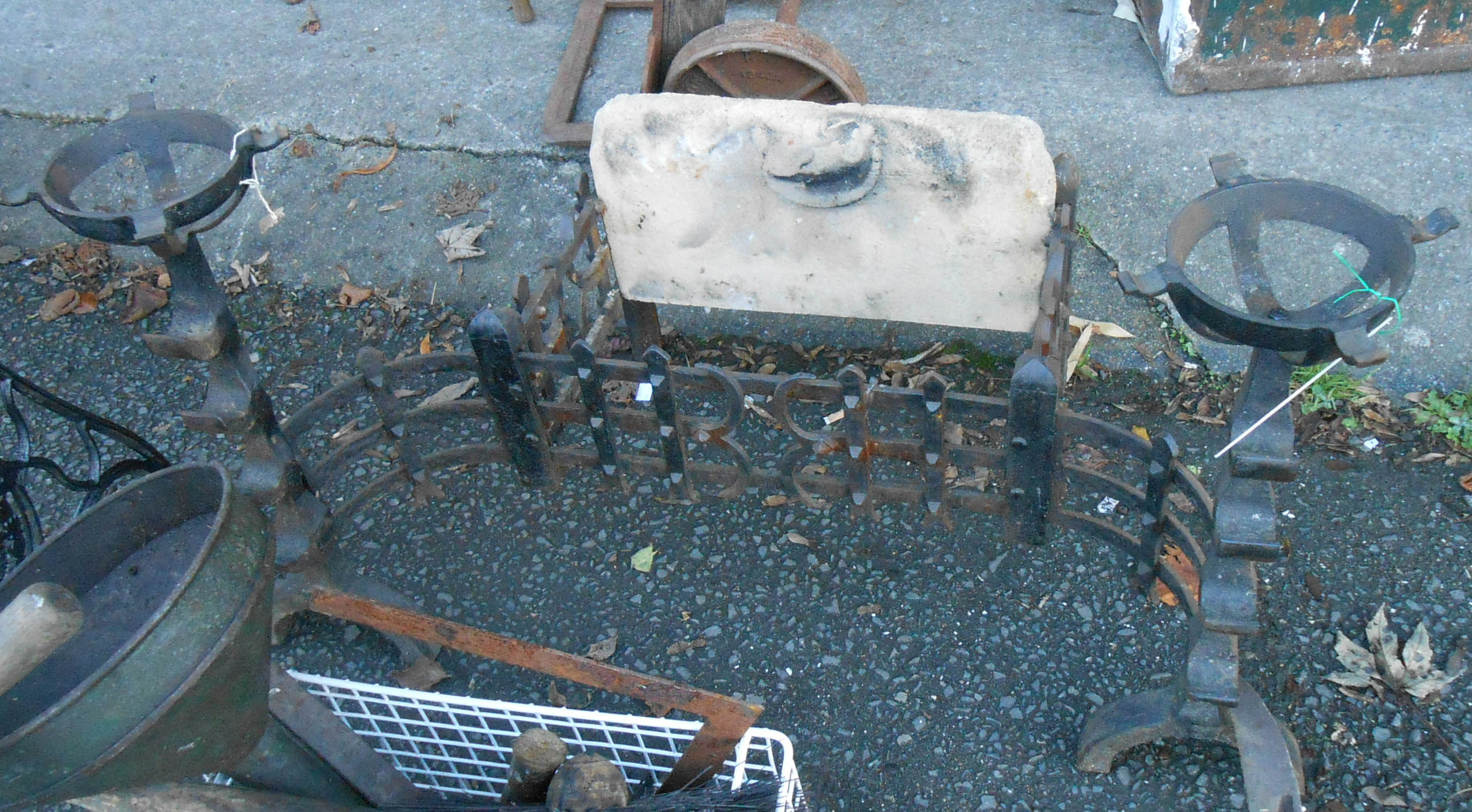 A 34" antique style fire grate with flanking mull holders