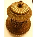 A 6 1/2" high Indian Tanjore ware lidded copper pot with silver Hindu characters, acanthus, floral