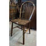 A pair of 20th Century hoop stick back kitchen chairs with solid elm seats and simple turned