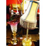 A brass table lamp and shade - sold with a chamberstick pattern table lamp with flared frosted and