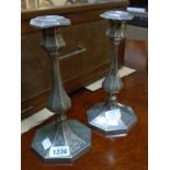 A pair of 10 1/2" Elkington & Co. silver plated candlesticks of faceted design with engraved