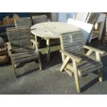 A set of four slatted hardwood framed garden elbow chairs - sold with a 4' 2" diameter garden