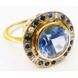 A Kate Higham bespoke 18ct. white and yellow gold ring, set with central 7ct. tanzanite within a