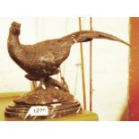 A bronzed model of a pheasant, set on a marble socle