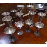 A set of six silver plated wine goblets - sold with four coupes and a pair of larger goblets with