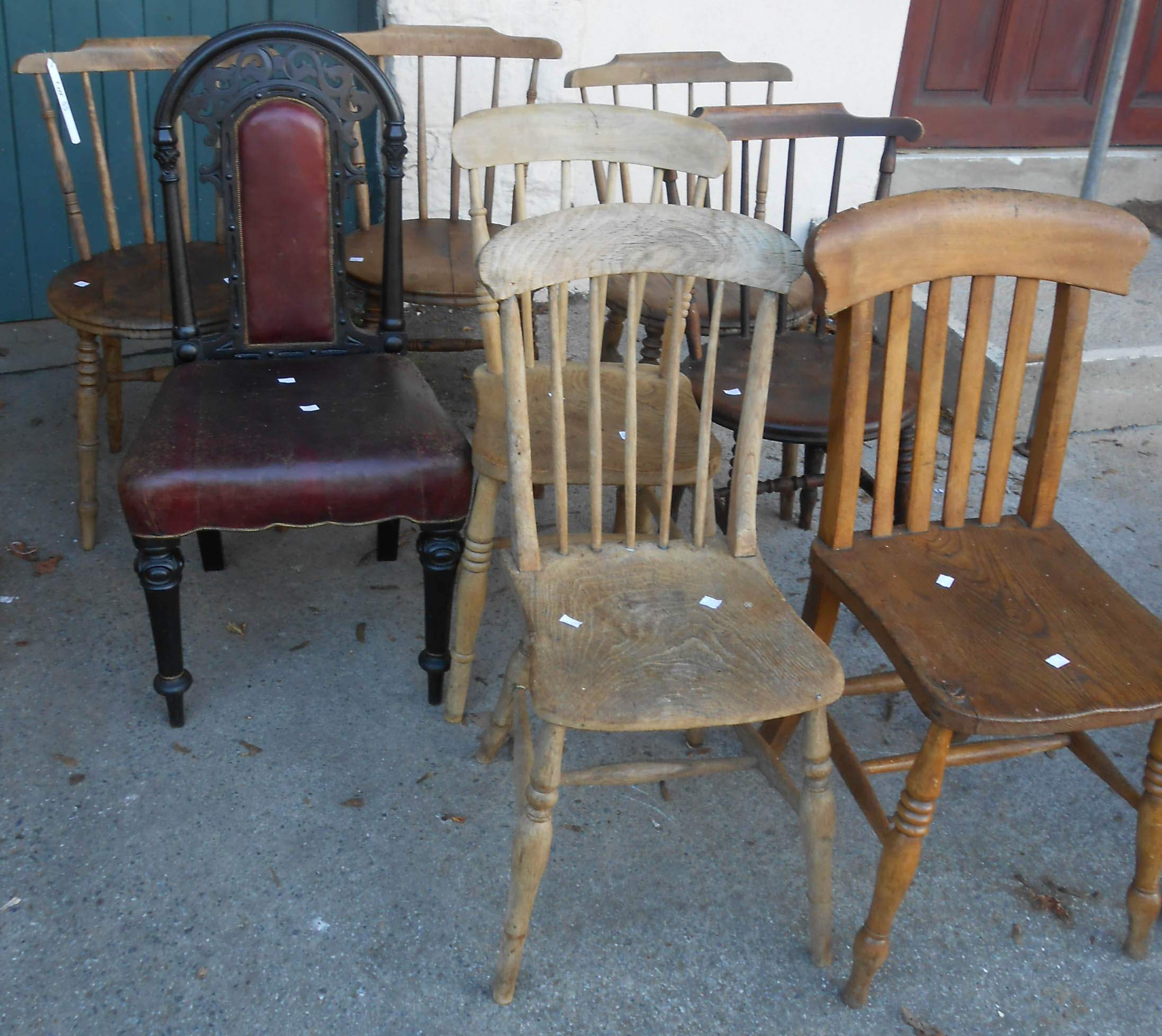 Three matching kitchen chairs with circular planked seats, set on ring turned supports, and a