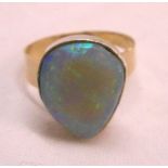 A bespoke yellow and white metal opal ring