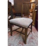 A pair of 19th Century mahogany framed stick back dining chairs with upholstered seats, set on