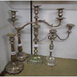 A pair of 11" ornate silver plated candlesticks with C-scroll decoration, a three branch candelabrum