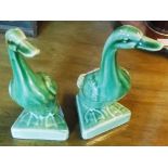 A pair of monochrome pottery ducks