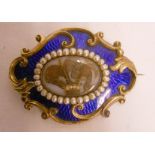 A 2 1/2" 19th Century ornate yellow metal and cobalt blue enamelled mourning brooch with central