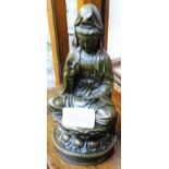 A reproduction bronzed seated Buddha