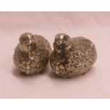 A pair of continental marked 925 white metal quail pattern salt and pepper pots