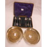 A pair of Mappin & Webb silver wine bottle coasters with turned wood bases - sold with a cased set