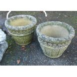 A pair of concrete planters