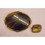 A rectangular gilt metal brooch with central citrine - sold with an oval agate brooch with gilt