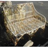 A 3' 2" antique painted wire work garden bench with Gothic style decoration