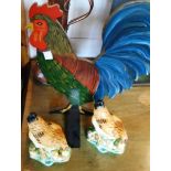 A pair of ceramic hen and chick figures - sold with a painted wooden chicken