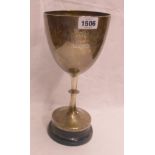 A 10 1/2" silver trophy goblet with text "Widecombe Pony Races, Hameldown Stakes", set on a wooden